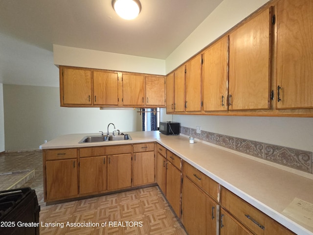 3629 Alpine Dr, Lansing, MI 48911 - kitchen featuring light countertops, brown cabinetry, and black appliances
