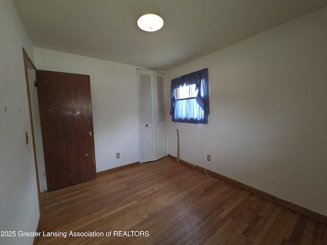 3629 Alpine Dr, Lansing, MI 48911 - spare room with wood finished floors and baseboards