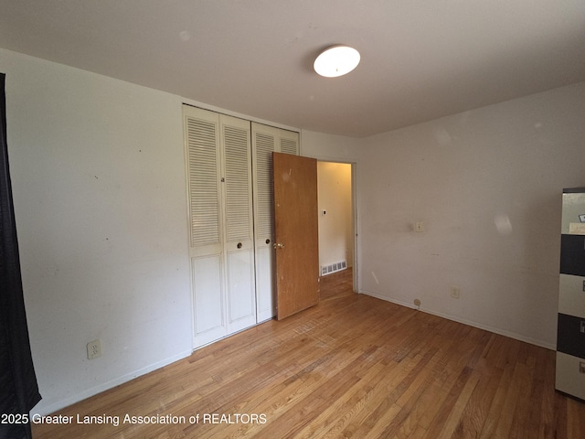 3629 Alpine Dr, Lansing, MI 48911 - unfurnished bedroom featuring light wood finished floors and a closet