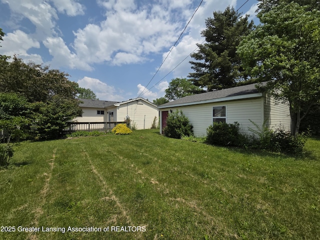 3629 Alpine Dr, Lansing, MI 48911 - view of green lawn with a wooden deck