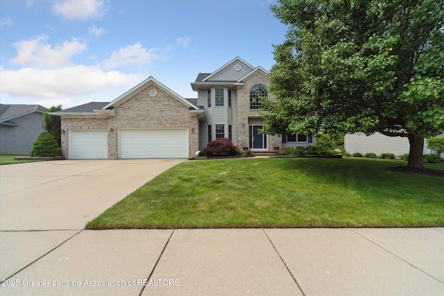 11195 Prestwick Dr, Lansing, MI 48917 - traditional-style house with an attached garage, a front lawn, concrete driveway, and brick siding