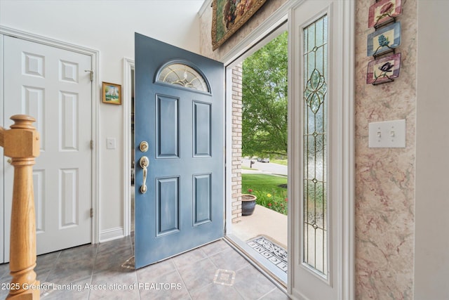 11195 Prestwick Dr, Lansing, MI 48917 - tiled foyer entrance with baseboards
