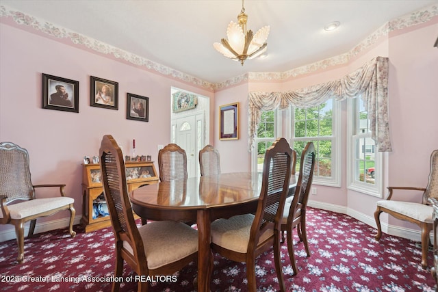 11195 Prestwick Dr, Lansing, MI 48917 - dining space with carpet floors and a chandelier