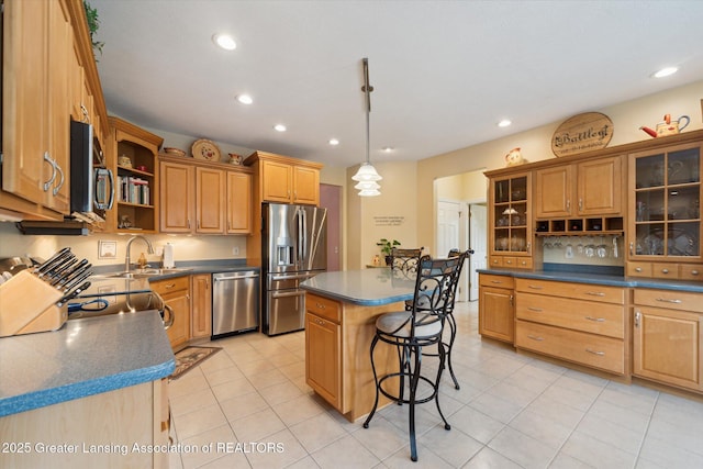 11195 Prestwick Dr, Lansing, MI 48917 - kitchen featuring appliances with stainless steel finishes, open shelves, a breakfast bar, dark countertops, and recessed lighting