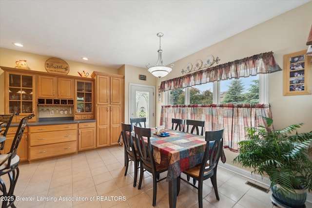 11195 Prestwick Dr, Lansing, MI 48917 - dining room featuring light tile patterned floors and recessed lighting