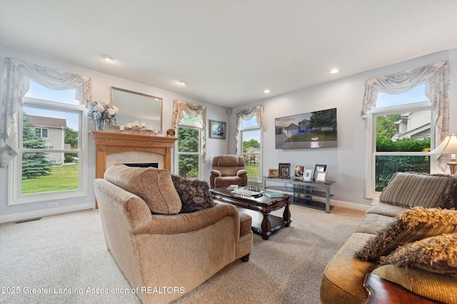 11195 Prestwick Dr, Lansing, MI 48917 - living room with light carpet, a fireplace, and recessed lighting