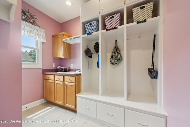 11195 Prestwick Dr, Lansing, MI 48917 - mudroom featuring light tile patterned floors and baseboards