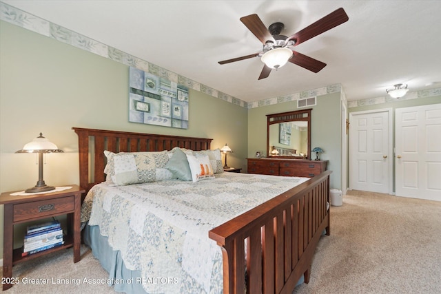 11195 Prestwick Dr, Lansing, MI 48917 - bedroom with light colored carpet and ceiling fan