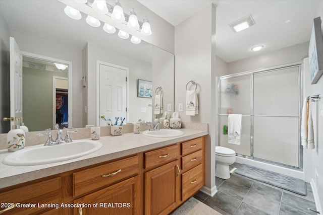 11195 Prestwick Dr, Lansing, MI 48917 - bathroom with double vanity, a shower stall, and tile patterned floors