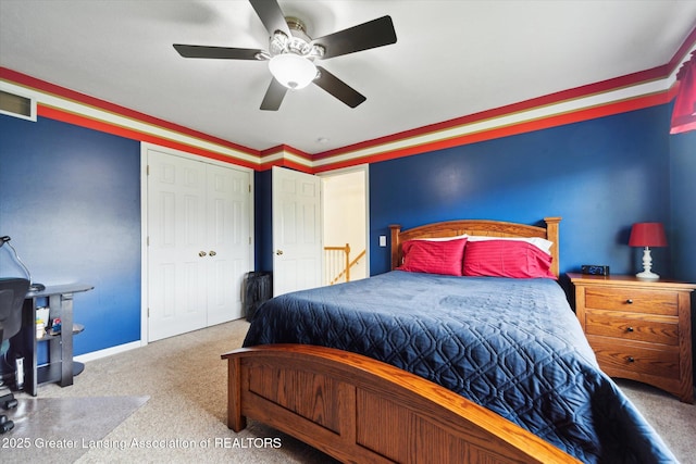 11195 Prestwick Dr, Lansing, MI 48917 - carpeted bedroom with a ceiling fan and a closet