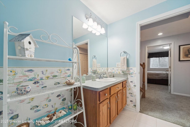 11195 Prestwick Dr, Lansing, MI 48917 - bathroom featuring vanity, ensuite bathroom, and tile patterned flooring
