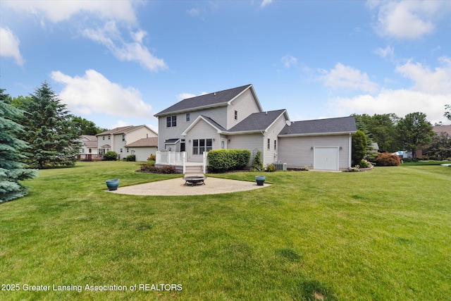 11195 Prestwick Dr, Lansing, MI 48917 - view of front facade with an outdoor fire pit, a patio area, and a front lawn
