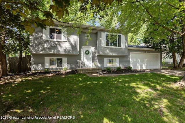 1539 Jacqueline Dr, Holt, MI 48842 - split foyer home featuring an attached garage and driveway