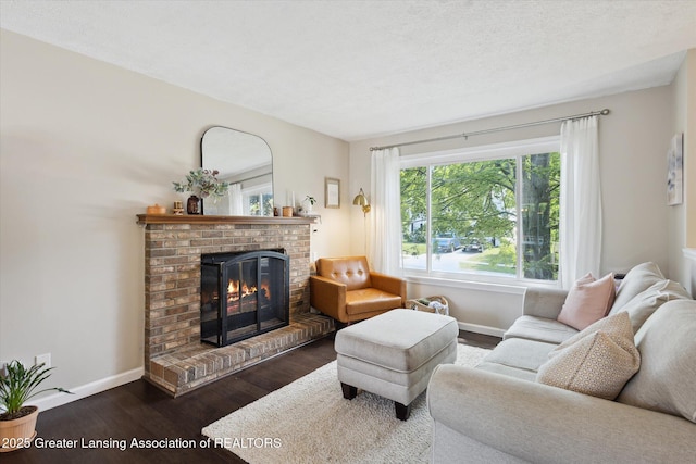 1539 Jacqueline Dr, Holt, MI 48842 - living room featuring dark wood-type flooring and a brick fireplace