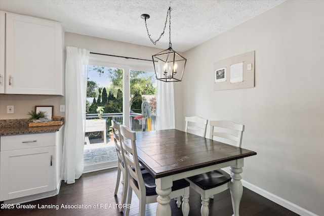 1539 Jacqueline Dr, Holt, MI 48842 - dining space with dark wood-type flooring, a chandelier, and a textured ceiling