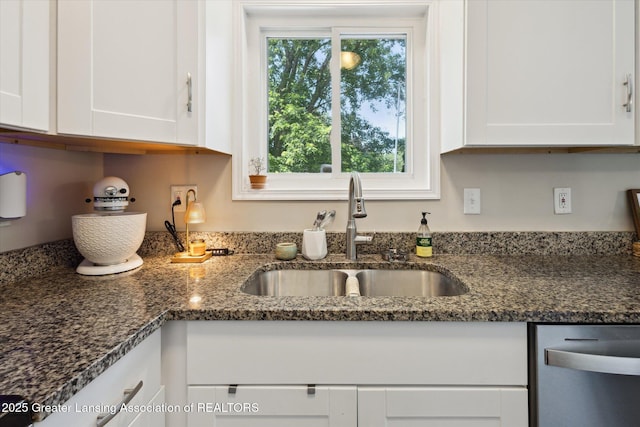 1539 Jacqueline Dr, Holt, MI 48842 - kitchen featuring dishwasher, white cabinets, and dark stone counters