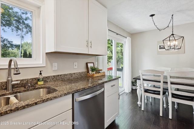 1539 Jacqueline Dr, Holt, MI 48842 - kitchen featuring dishwasher, white cabinets, dark wood-style floors, dark stone counters, and a chandelier