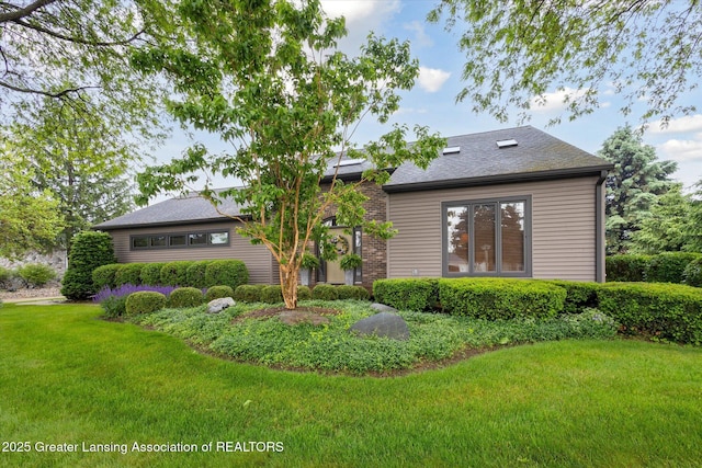 4925 Aspen Dr, Lansing, MI 48917 - back of house with a yard