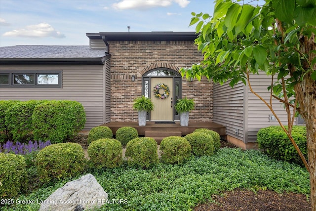 4925 Aspen Dr, Lansing, MI 48917 - property entrance featuring brick siding