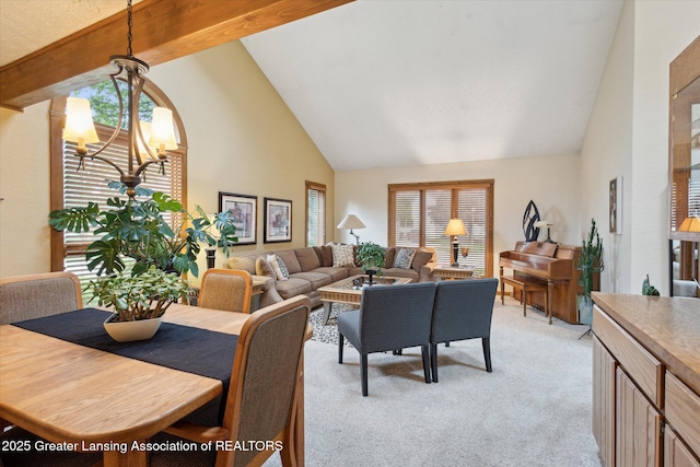 4925 Aspen Dr, Lansing, MI 48917 - living room featuring a chandelier, high vaulted ceiling, light carpet, and beamed ceiling