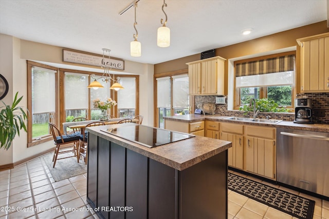 4925 Aspen Dr, Lansing, MI 48917 - kitchen with dishwasher, black electric cooktop, backsplash, and light tile patterned floors