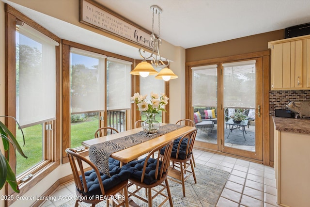 4925 Aspen Dr, Lansing, MI 48917 - dining area with plenty of natural light and light tile patterned floors