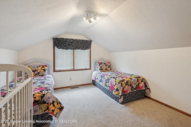 4925 Aspen Dr, Lansing, MI 48917 - bedroom with carpet, a textured ceiling, and vaulted ceiling