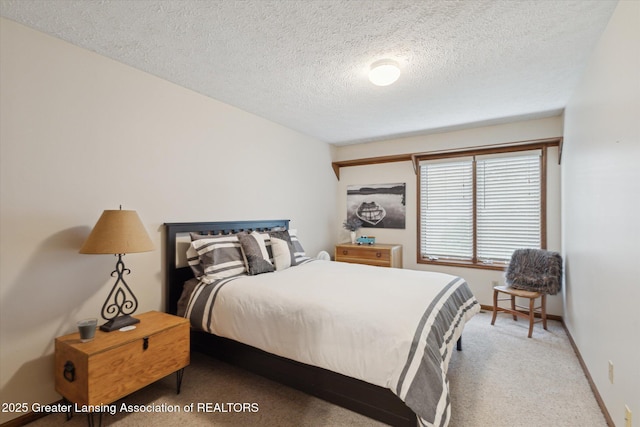 4925 Aspen Dr, Lansing, MI 48917 - carpeted bedroom featuring a textured ceiling and baseboards