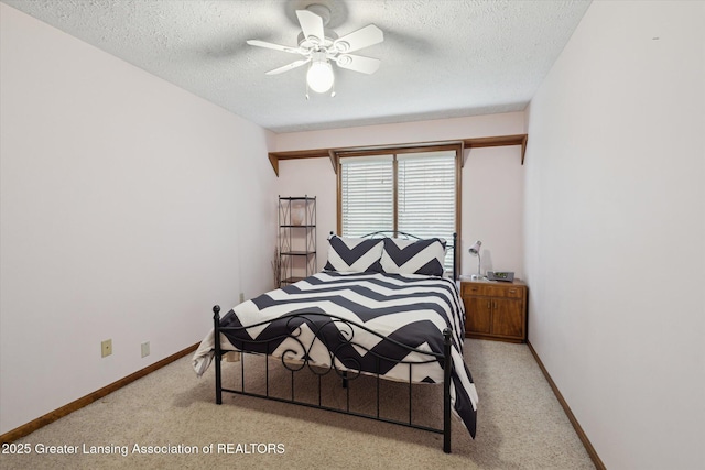 4925 Aspen Dr, Lansing, MI 48917 - bedroom featuring light carpet, a textured ceiling, and a ceiling fan