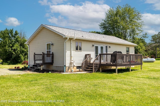 2520 Linn Rd, Williamston, MI 48895 - back of house featuring a deck, a yard, roof with shingles, and french doors