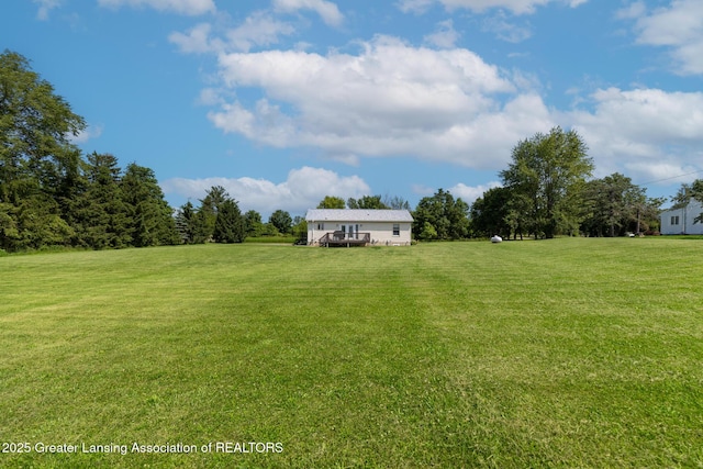 2520 Linn Rd, Williamston, MI 48895 - view of grassy yard featuring a deck
