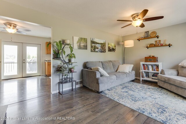 2520 Linn Rd, Williamston, MI 48895 - living area featuring a ceiling fan, dark wood-style flooring, and french doors