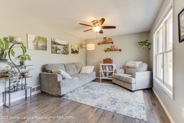 2520 Linn Rd, Williamston, MI 48895 - living room featuring a ceiling fan and wood finished floors
