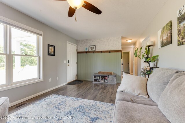 2520 Linn Rd, Williamston, MI 48895 - living room featuring wood finished floors and ceiling fan