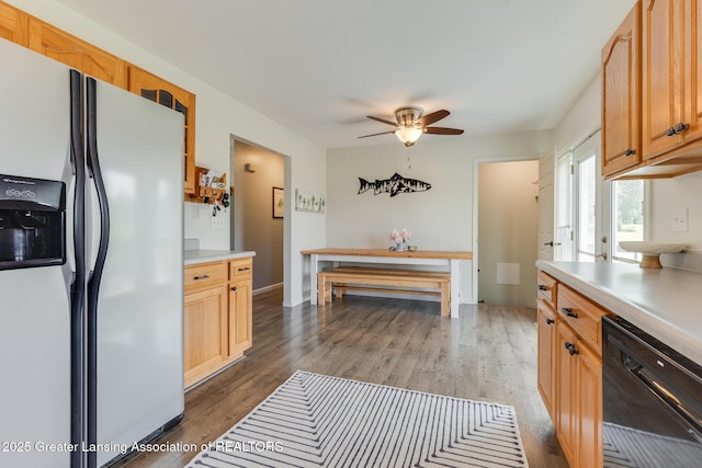 2520 Linn Rd, Williamston, MI 48895 - kitchen with white fridge with ice dispenser, dishwasher, light countertops, and wood finished floors