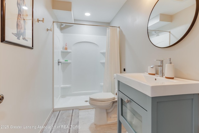 2520 Linn Rd, Williamston, MI 48895 - full bathroom with a shower with curtain, vanity, and wood finished floors