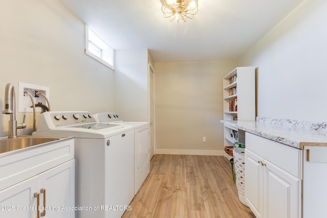 2520 Linn Rd, Williamston, MI 48895 - laundry area with independent washer and dryer, light wood finished floors, and cabinet space