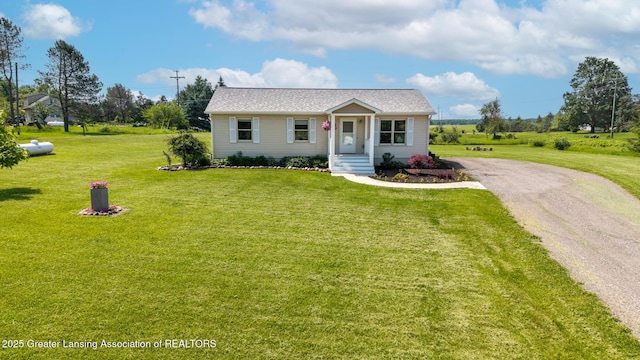 2520 Linn Rd, Williamston, MI 48895 - bungalow-style home featuring a front lawn and driveway