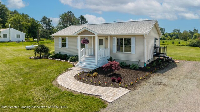 2520 Linn Rd, Williamston, MI 48895 - view of front facade featuring roof with shingles and a front lawn