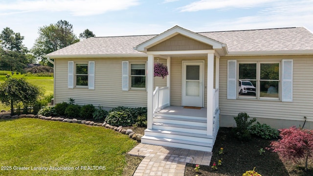 2520 Linn Rd, Williamston, MI 48895 - bungalow-style home featuring roof with shingles and a front yard