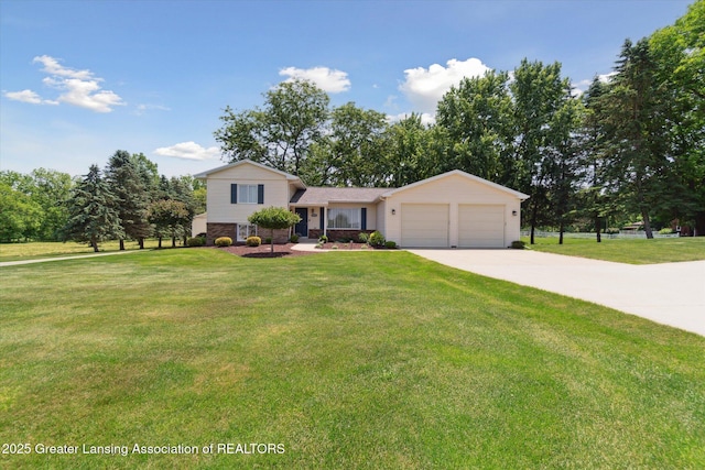 6252 N River Hwy, Grand Ledge, MI 48837 - split level home featuring an attached garage, driveway, and a front lawn