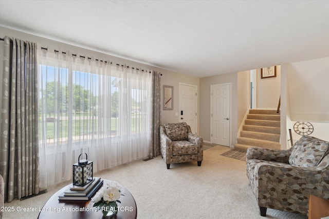 6252 N River Hwy, Grand Ledge, MI 48837 - living area featuring stairway and carpet