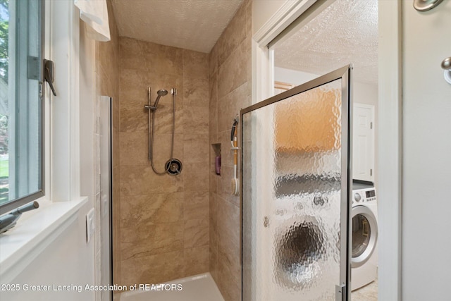 6252 N River Hwy, Grand Ledge, MI 48837 - bathroom featuring washer / dryer, a stall shower, and a textured ceiling