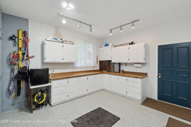 6252 N River Hwy, Grand Ledge, MI 48837 - kitchen featuring white cabinets and rail lighting