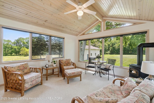 6252 N River Hwy, Grand Ledge, MI 48837 - carpeted living room with a wood stove, wood ceiling, and a ceiling fan