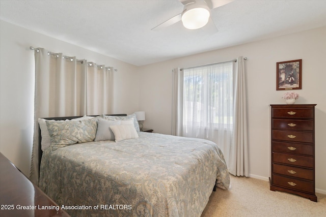 6252 N River Hwy, Grand Ledge, MI 48837 - bedroom with light carpet and ceiling fan