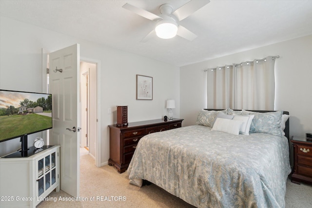 6252 N River Hwy, Grand Ledge, MI 48837 - bedroom featuring light colored carpet and ceiling fan