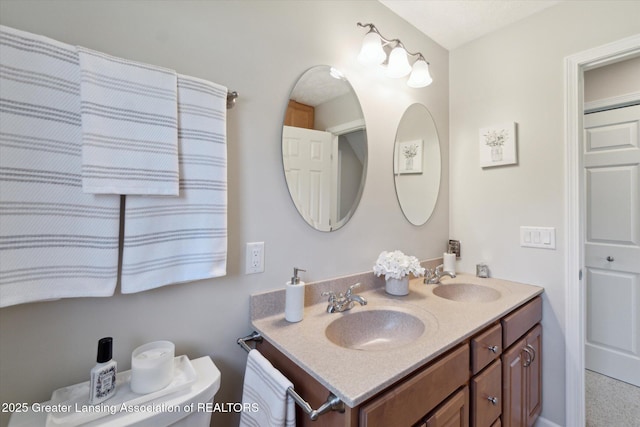 6252 N River Hwy, Grand Ledge, MI 48837 - bathroom with double vanity and toilet