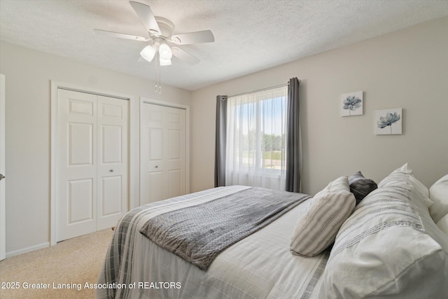 6252 N River Hwy, Grand Ledge, MI 48837 - carpeted bedroom featuring a textured ceiling and ceiling fan