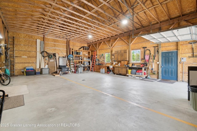 6252 N River Hwy, Grand Ledge, MI 48837 - garage featuring a workshop area